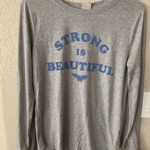 A long sleeve “strong is beautiful” tee